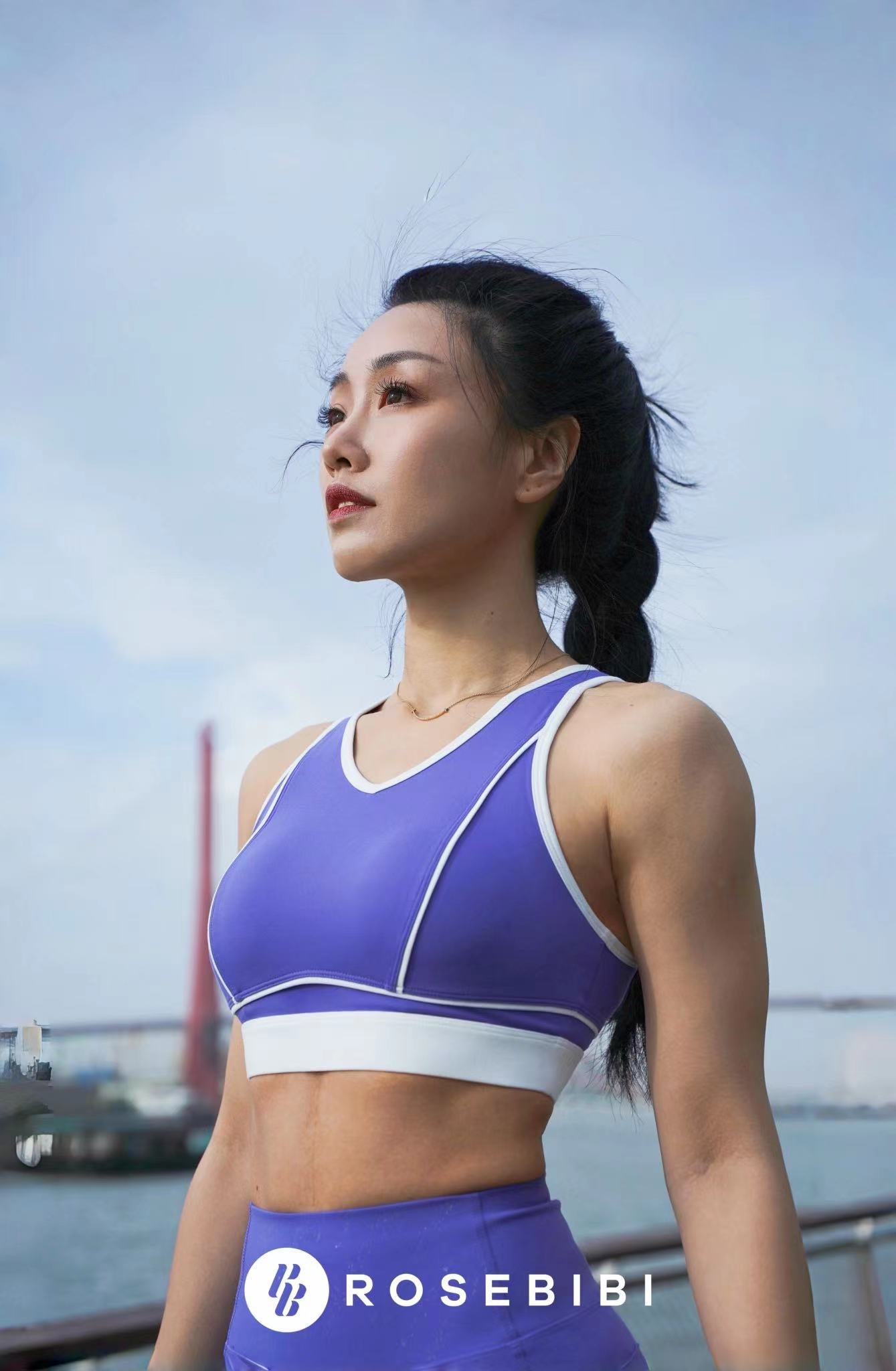 Model wearing a petite size ROSEBIBI Power Full Sporty Bra in wisteria color